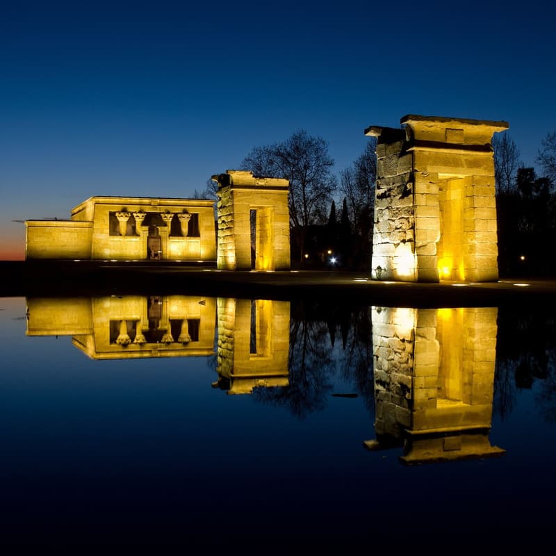 The Templo de Debod reflected in its pool at sunset in Madrid
