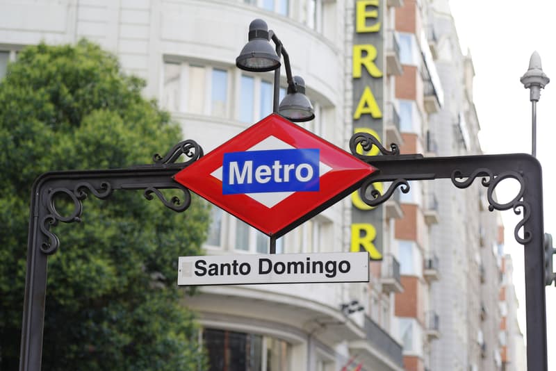 The red and blue Madrid Metro sign at Santo Domingo station on Gran Via